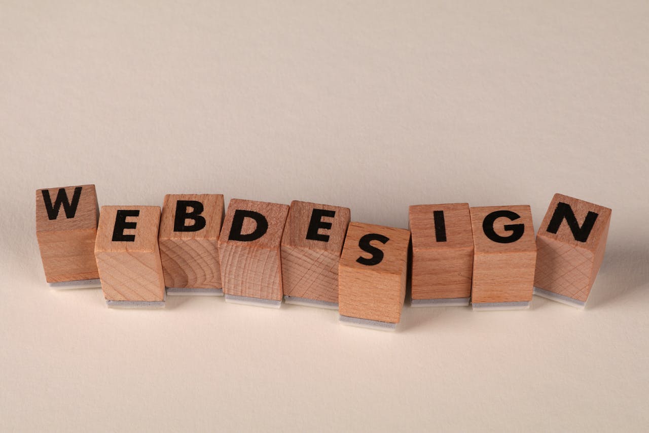 Services Wooden blocks spelling 'web design' creatively showcase digital design concept.